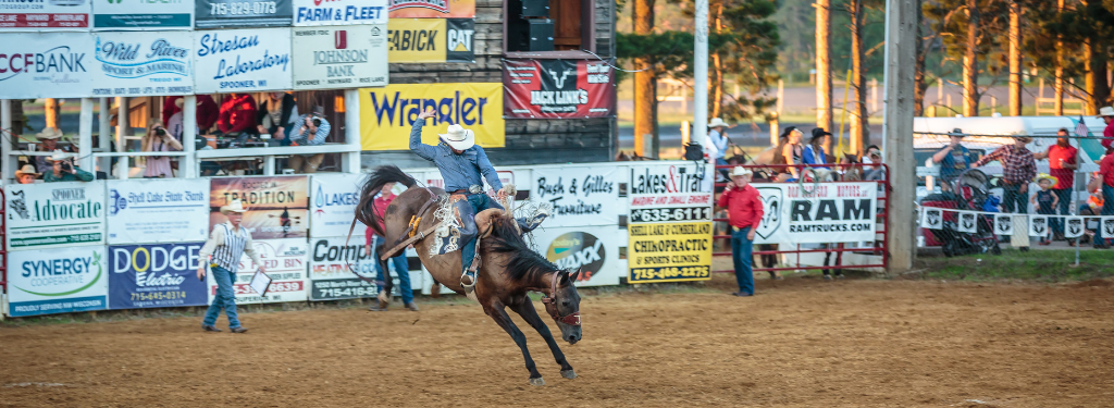 Saddle Bronc at Spooner Rodeo, Washburn County; Photo: James Netz Photography
